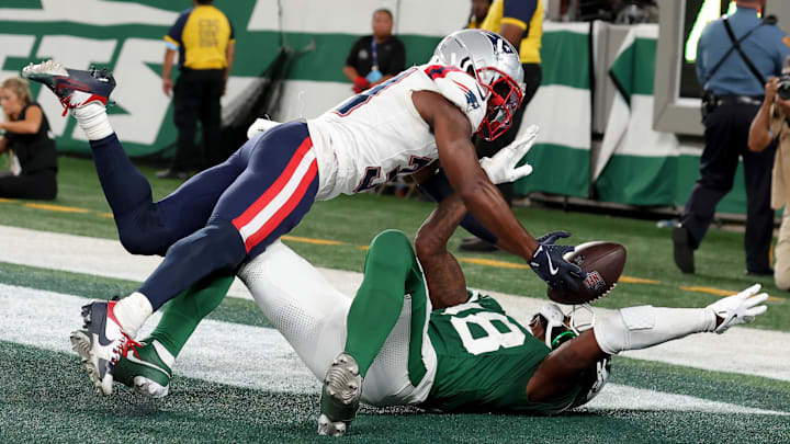 Sep 19, 2024; East Rutherford, New Jersey, USA; New England Patriots cornerback Jonathan Jones (31) breaks up a pass intended for New York Jets wide receiver Mike Williams (18) during the fourth quarter at MetLife Stadium.
