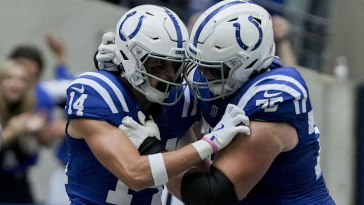 Sep 8, 2024; Indianapolis, Indiana, USA; Indianapolis Colts wide receiver Alec Pierce (14) celebrates with Indianapolis Colts guard Will Fries (75) after scoring a touchdown at Lucas Oil Stadium. Mandatory Credit: Christine Tannous-USA TODAY Network via Imagn Images