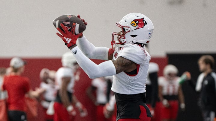 Louisville football wide receiver Jimmy Calloway (7) runs drills during spring practice on Saturday, March 23, 2024 at the Trager practice facility in Louisville, Ky.