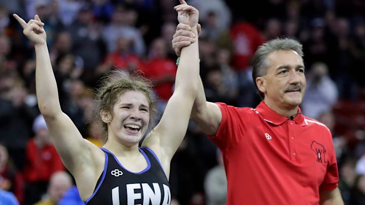 Lena High School's Taylor Whiting celebrates after defeating Emjay Neumann of Manitowoc Lincoln in the girls 114-pound championship match during the WIAA state individual wrestling tournament on Saturday, February 28, 2026. Whiting won the match by decision, 10-5, to become the first girl to win four state wrestling titles in WIAA history. Wm. Glasheen USA TODAY NETWORK-Wisconsin