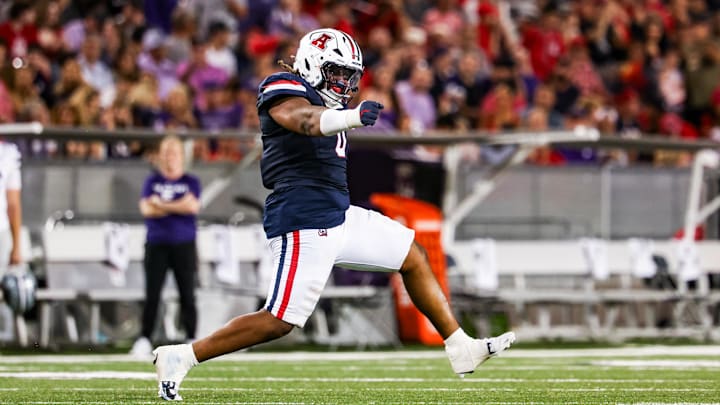 Sep 12, 2025; Tucson, Arizona, USA; Arizona Wildcats defensive lineman Deshawn McKnight (0) celebrates after he tackles the Kansas State Wildcats during the third quarter of the game at Arizona Stadium. Mandatory Credit: Aryanna Frank-Imagn Images Sep 12, 2025; Tucson, Arizona, USA; Arizona Wildcats defensive lineman Deshawn McKnight (0) celebrates after he tackles the Kansas State Wildcats during the third quarter of the game at Arizona Stadium. Mandatory Credit: Aryanna Frank-Imagn Images