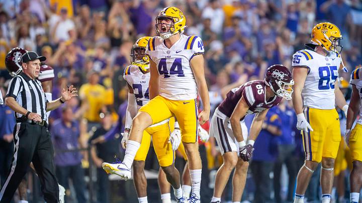 Sep 17, 2022; Baton Rouge, Louisiana, USA; LSU Tigers long snapper Slade Roy (44) celebrates after coming up with the ball against the Mississippi State Bulldogs at Tiger Stadium. Mandatory Credit: Scott Clause-Imagn Images Sep 17, 2022; Baton Rouge, Louisiana, USA; LSU Tigers long snapper Slade Roy (44) celebrates after coming up with the ball against the Mississippi State Bulldogs at Tiger Stadium. Mandatory Credit: Scott Clause-Imagn Images