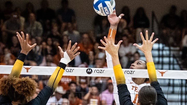 Texas Longhorns middle blocker Marianna Singletary (11) hits the ball over the net during the Longhorns' match-up with the Missouri Tigers at the Gregory Gym in Austin, Nov. 1, 2024. Texas Longhorns middle blocker Marianna Singletary (11) hits the ball over the net during the Longhorns' match-up with the Missouri Tigers at the Gregory Gym in Austin, Nov. 1, 2024.