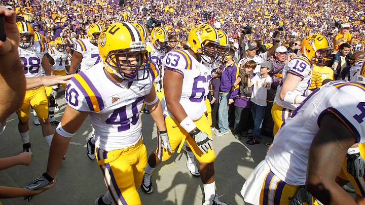 November 25, 2011; Baton Rouge, LA, USA; The LSU Tigers make their way onto the field prior to kickoff against the Arkansas Razorbacks at Tiger Stadium. LSU defeated Arkansas 41-17. Mandatory Credit: Crystal LoGiudice-USA TODAY Sports November 25, 2011; Baton Rouge, LA, USA; The LSU Tigers make their way onto the field prior to kickoff against the Arkansas Razorbacks at Tiger Stadium. LSU defeated Arkansas 41-17. Mandatory Credit: Crystal LoGiudice-USA TODAY Sports