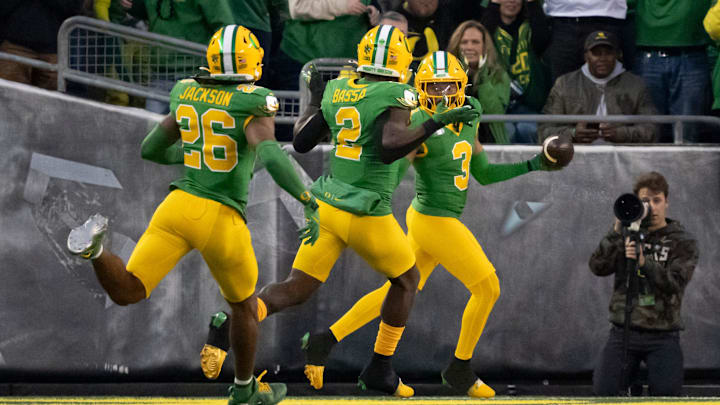 Oregon defensive back Brandon Johnson celebrates a defensive touchdown after a fumble forced by Oregon defensive end Jordan Burch as the Oregon Ducks host the Maryland Terrapins at Autzen Stadium Saturday, Nov. 9, 2024, in Eugene, Ore.