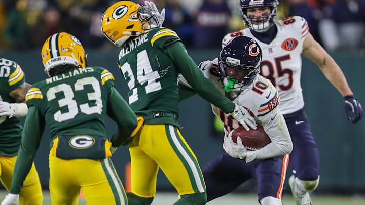 Luther Burden III stiff-arms Green Bay Packers cornerback Carrington Valentine (24) during the Bears' 28-21 loss at Green Bay. Luther Burden III stiff-arms Green Bay Packers cornerback Carrington Valentine (24) during the Bears' 28-21 loss at Green Bay.