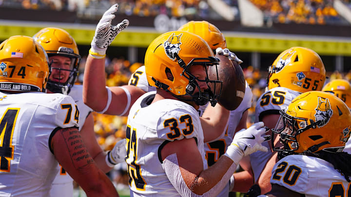 Sep 7, 2024; Laramie, Wyoming, USA; Idaho Vandals tight end Jake Cox (33) celebrates a touchdown against the Wyoming Cowboys during the second quarter at Jonah Field at War Memorial Stadium. Mandatory Credit: Troy Babbitt-Imagn Images