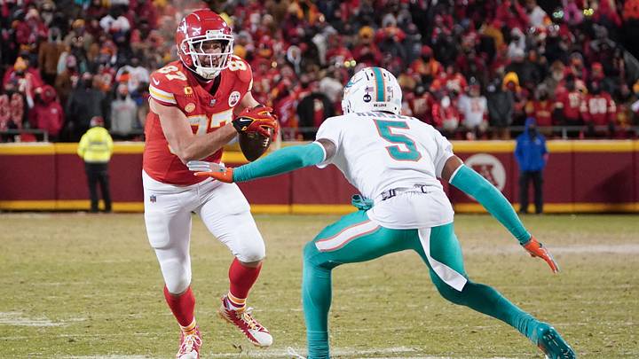 Kansas City Chiefs tight end Travis Kelce (87) runs the ball as Miami Dolphins cornerback Jalen Ramsey (5) defends in a 2024 AFC wild card game at GEHA Field at Arrowhead Stadium. Kansas City Chiefs tight end Travis Kelce (87) runs the ball as Miami Dolphins cornerback Jalen Ramsey (5) defends in a 2024 AFC wild card game at GEHA Field at Arrowhead Stadium.