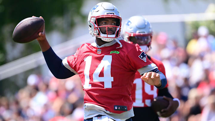 Jul 26, 2024; Foxborough, MA, USA;  New England Patriots quarterback Jacoby Brissett (14) throws a pass during training camp at Gillette Stadium. Mandatory Credit: Eric Canha-USA TODAY Sports