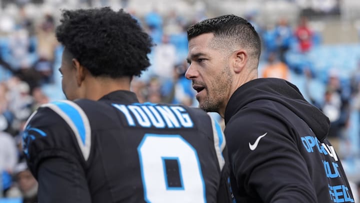 Dec 21, 2025; Charlotte, North Carolina, USA; Carolina Panthers head coach Dave Canales greets quarterback Bryce Young (9) after a win against the Tampa Bay Buccaneers at Bank of America Stadium. Mandatory Credit: Jim Dedmon-Imagn Images