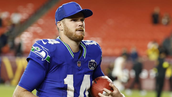 Nov 2, 2025; Landover, Maryland, USA;  Seattle Seahawks quarterback Sam Darnold (14) leaves the field after the win against the Washington Commanders at Northwest Stadium. Mandatory Credit: Geoff Burke-Imagn Images