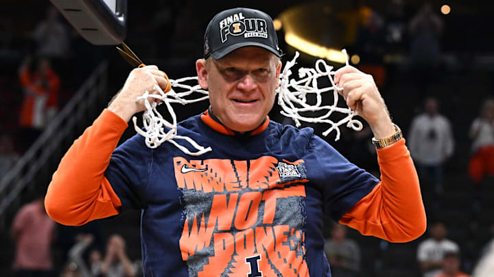 Mar 28, 2026; Houston, TX, USA; Illinois Fighting Illini head coach Brad Underwood celebrates after cutting down the net after defeating the Iowa Hawkeyes in an Elite Eight game of the South Regional of the men's 2026 NCAA Tournament at Toyota Center. Mandatory Credit: Maria Lysaker-Imagn Images
