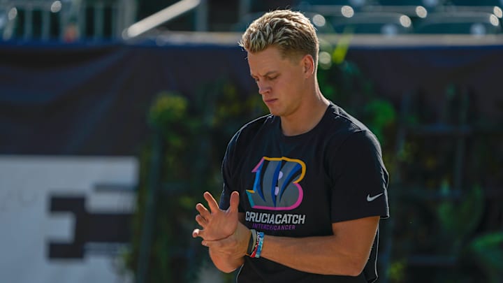 Cincinnati Bengals quarterback Joe Burrow (9) rubs is wrist during warm-ups before the NFL Week 5 matchup against the Baltimore Ravens Sunday October 6, 2024 at Payor Stadium.