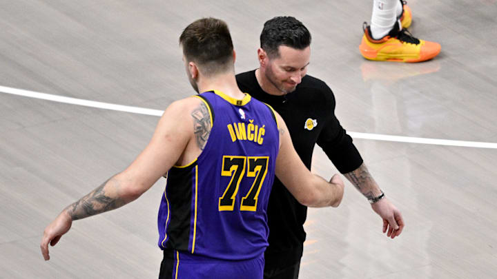 Apr 9, 2025; Dallas, Texas, USA; Los Angeles Lakers head coach JJ Redick and guard Luka Doncic (77) during the game between the Dallas Mavericks and the Los Angeles Lakers at American Airlines Center. Mandatory Credit: Jerome Miron-Imagn Images