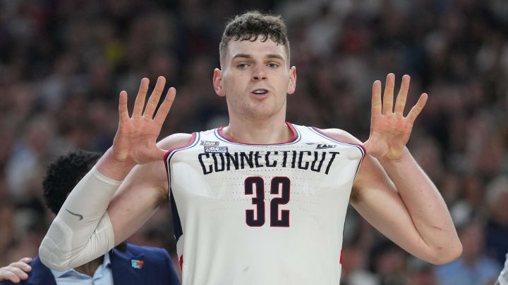 Apr 8, 2024; Glendale, AZ, USA; Connecticut Huskies center Donovan Clingan (32) celebrates defeating