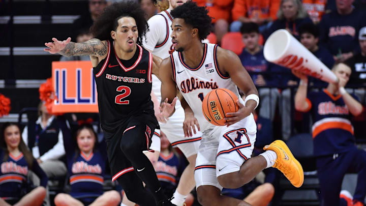 Jan 8, 2026; Champaign, Illinois, USA; Illinois Fighting Illini guard Brandon Lee (1) drives the ball around Rutgers Scarlet Knights guard Lino Mark (2) during the second half at State Farm Center. Mandatory Credit: Ron Johnson-Imagn Images Jan 8, 2026; Champaign, Illinois, USA; Illinois Fighting Illini guard Brandon Lee (1) drives the ball around Rutgers Scarlet Knights guard Lino Mark (2) during the second half at State Farm Center. Mandatory Credit: Ron Johnson-Imagn Images