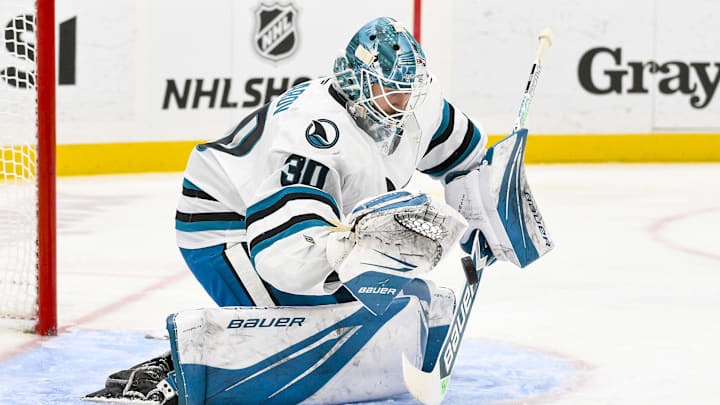 Nov 21, 2024; St. Louis, Missouri, USA;  San Jose Sharks goaltender Yaroslav Askarov (30) defends the net against the St. Louis Blues during the second period at Enterprise Center. Mandatory Credit: Jeff Curry-Imagn Images