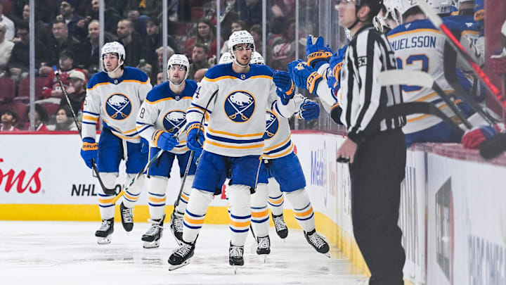 Dec 17, 2024; Montreal, Quebec, CAN; Buffalo Sabres center Dylan Cozens (24) celebrates his goal with his teammates at the bench against the Montreal Canadiens during the second period at Bell Centre. Mandatory Credit: David Kirouac-Imagn Images