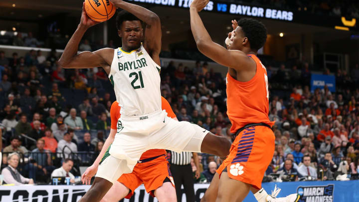 Mar 24, 2024; Memphis, TN, USA; Baylor Bears center Yves Missi (21) controls the ball against Clemson Tigers forward RJ Godfrey (10) in the second half in the second round of the 2024 NCAA Tournament at FedExForum. Mandatory Credit: Petre Thomas-USA TODAY Sports Mar 24, 2024; Memphis, TN, USA; Baylor Bears center Yves Missi (21) controls the ball against Clemson Tigers forward RJ Godfrey (10) in the second half in the second round of the 2024 NCAA Tournament at FedExForum. Mandatory Credit: Petre Thomas-USA TODAY Sports