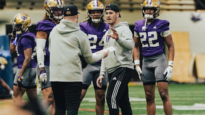 Vinnie Sunseri offers direction to his Husky safeties. 