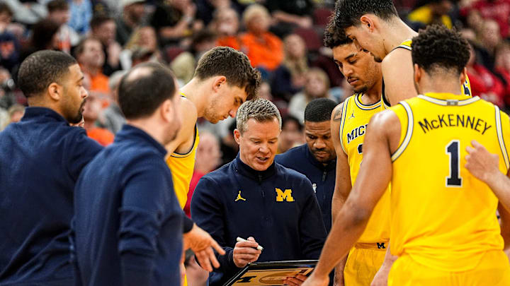 Michigan head coach Dusty May talks to players at a timeout against Wisconsin during the second half of Big Ten Tournament semifinal at United Center in Chicago on Saturday, March 14, 2026.