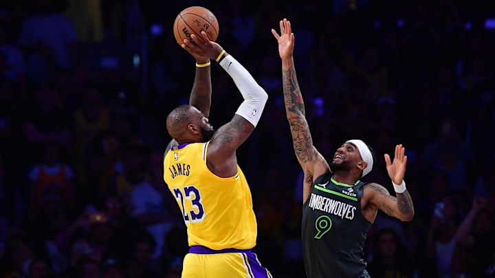 Apr 30, 2025; Los Angeles, California, USA; Los Angeles Lakers forward LeBron James (23) shoots against Minnesota Timberwolves guard Nickeil Alexander-Walker (9) during the second half in game five of first round for the 2025 NBA Playoffs at Crypto.com Arena. Mandatory Credit: Gary A. Vasquez-Imagn Images Apr 30, 2025; Los Angeles, California, USA; Los Angeles Lakers forward LeBron James (23) shoots against Minnesota Timberwolves guard Nickeil Alexander-Walker (9) during the second half in game five of first round for the 2025 NBA Playoffs at Crypto.com Arena. Mandatory Credit: Gary A. Vasquez-Imagn Images