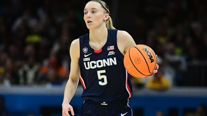 Connecticut Huskies guard Paige Bueckers (5) dribbles the ball against the Iowa Hawkeyes.