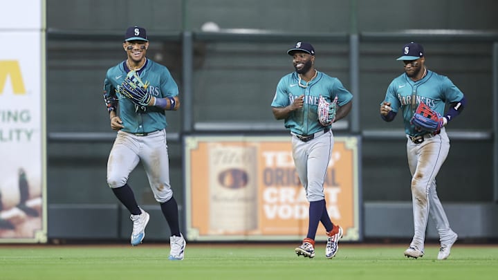 Seattle Mariners center fielder Julio Rodriguez (44) jogs off the field with left fielder Randy Arozarena (56) and right fielder Victor Robles (10) after the game against the Houston Astros at Minute Maid Park on Sept 23.