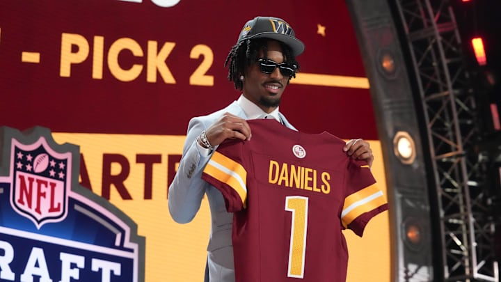 LSU Tigers quarterback Jayden Daniels poses after being selected by the Washington Commanders as the No. 2 pick in the first round of the 2024 NFL Draft at Campus Martius Park and Hart Plaza. Mandatory Credit: Kirby Lee-Imagn Images