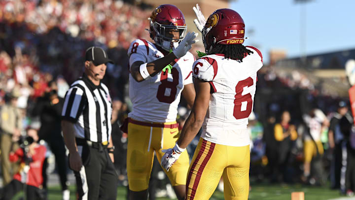 Oct 19, 2024; College Park, Maryland, USA; Southern California Trojans wide receiver Ja'Kobi Lane (8) celebrates with  Trojans wide receiver Makai Lemon (6) after scoring first half touchdown against the Maryland Terrapins  at SECU Stadium. Mandatory Credit: Tommy Gilligan-Imagn Images