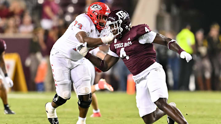 Sep 2, 2023; College Station, Texas, USA; Texas A&M Aggies defensive lineman Shemar Stewart (4) breaks past New Mexico Lobos offensive lineman Matthew Toilolo (74) during the fourth quarter at Kyle Field. Mandatory Credit: Maria Lysaker-Imagn Images