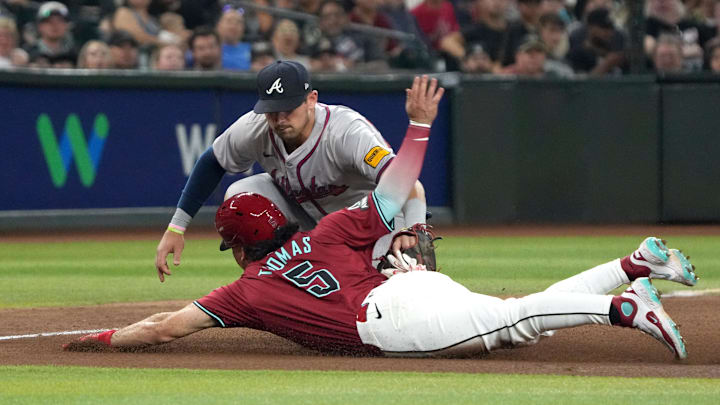 Jul 11, 2024; Phoenix, Arizona, USA; Atlanta Braves third base Austin Riley (27) tags out Arizona Diamondbacks outfielder Alek Thomas (5) in the eighth inning at Chase Field. Mandatory Credit: Rick Scuteri-Imagn Images Jul 11, 2024; Phoenix, Arizona, USA; Atlanta Braves third base Austin Riley (27) tags out Arizona Diamondbacks outfielder Alek Thomas (5) in the eighth inning at Chase Field. Mandatory Credit: Rick Scuteri-Imagn Images