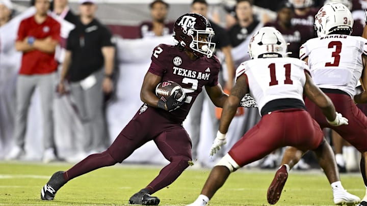 Nov 16, 2024; College Station, Texas, USA; Texas A&M Aggies wide receiver Terry Bussey (2) runs the ball during the fourth quarter against the New Mexico State Aggies at Kyle Field. Mandatory Credit: Maria Lysaker-Imagn Images 