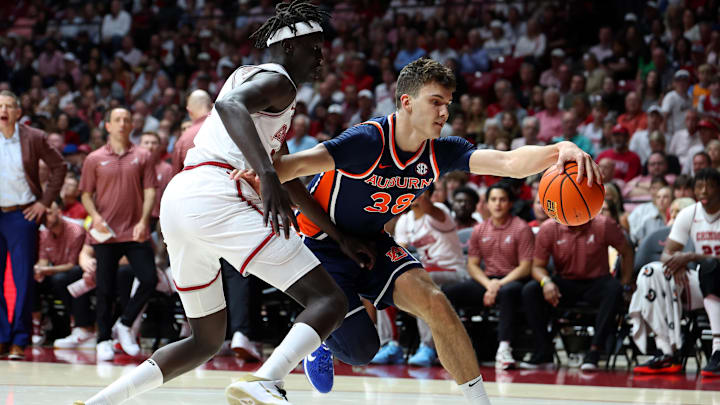 Mar 7, 2026; Tuscaloosa, Alabama, USA; Auburn Tigers forward Filip Jovic (38) dribbles against Alabama Crimson Tide forward Taylor Bol Bowen (7) during the first half at Coleman Coliseum. Mandatory Credit: David Leong-Imagn Images Mar 7, 2026; Tuscaloosa, Alabama, USA; Auburn Tigers forward Filip Jovic (38) dribbles against Alabama Crimson Tide forward Taylor Bol Bowen (7) during the first half at Coleman Coliseum. Mandatory Credit: David Leong-Imagn Images