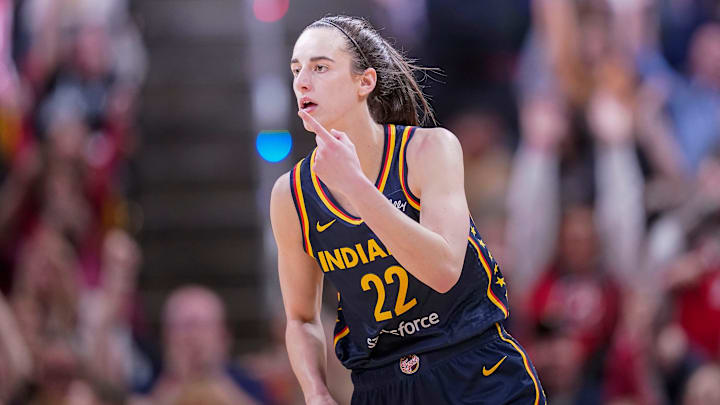 Indiana Fever guard Caitlin Clark (22) reacts to scoring three points Thursday, May 9, 2024, during the preseason game against the Atlanta Dream at Gainbridge Fieldhouse in Indianapolis. The Indiana Fever defeated the Atlanta Dream, 83-80.