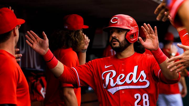 Aug 20, 2026; Cincinnati, Ohio, USA; Cincinnati Reds pinch hitter Eugenio Suarez (28) high fives teammate after scoring on a two-run single hit by second baseman Sal Stewart (not pictured) in the ninth inning against the St. Louis Cardinals at Great American Ball Park. Mandatory Credit: Katie Stratman-Imagn Images