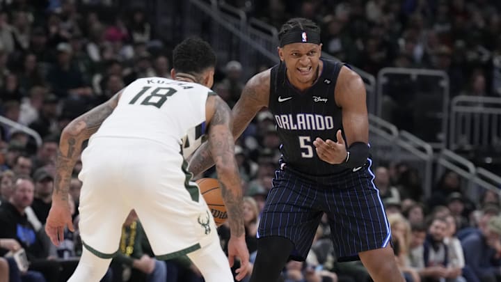 Orlando Magic forward Paolo Banchero (5) drives against Milwaukee Bucks forward Kyle Kuzma (18) in the second half at Fiserv Forum.