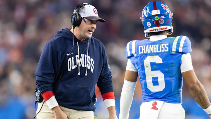 Jan 8, 2026; Glendale, AZ, USA; Mississippi Rebels quarterbacks coach Joe Judge with quarterback Trinidad Chambliss (6) against the Miami Hurricanes during the 2026 Fiesta Bowl and semifinal game of the College Football Playoff at State Farm Stadium. Mandatory Credit: Mark J. Rebilas-Imagn Images