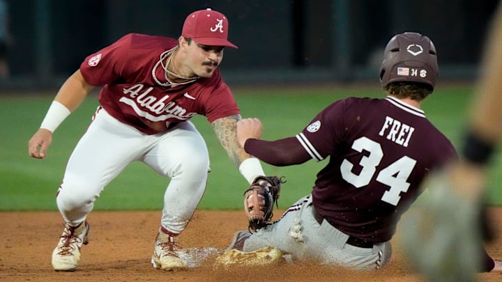 Alabama second baseman Brennen Norton (21) tags out Mississippi State base runner Gehrig Frei at Sewell-Thomas Stadium in Tuscaloosa Friday, April 11, 2025.