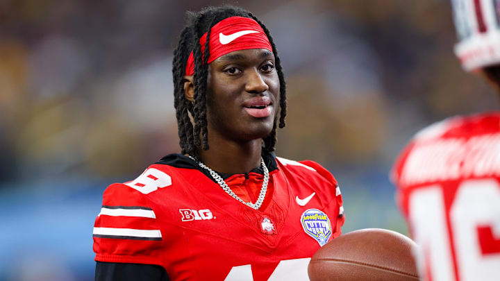 Dec 29, 2023; Arlington, TX, USA;  Ohio State Buckeyes wide receiver Marvin Harrison Jr. (18) looks