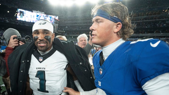 Philadelphia Eagles quarterback Jalen Hurts (1) and New York Giants quarterback Jaxson Dart (6) talks after the Thursday Night Football game between the New York Giants and the Philadelphia Eagles at MetLife Stadium in East Rutherford on Oct. 9, 2025.