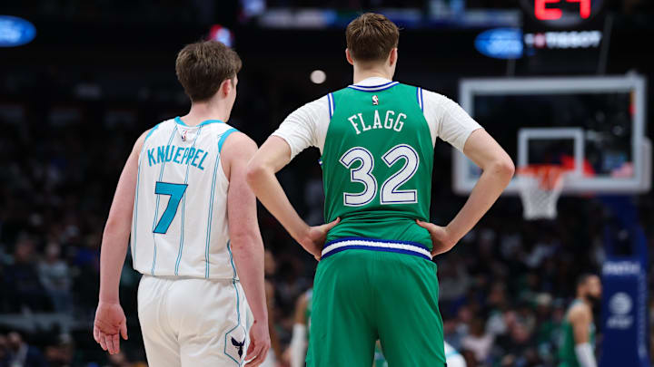 Jan 29, 2026; Dallas, Texas, USA;  Charlotte Hornets guard Kon Knueppel (7) stands with Dallas Mavericks forward Cooper Flagg (32) during the second half.