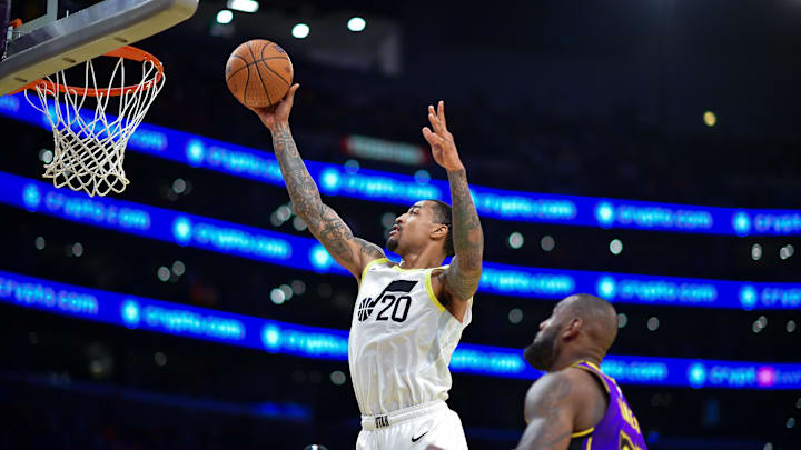 Nov 19, 2024; Los Angeles, California, USA; Utah Jazz forward John Collins (20) scores a basket against the Los Angeles Lakers during the second half at Crypto.com Arena. Mandatory Credit: Gary A. Vasquez-Imagn Images
