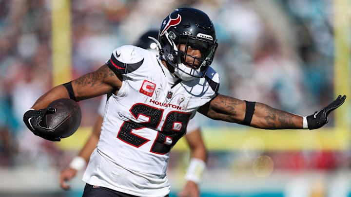 Dec 1, 2024; Jacksonville, Florida, USA; Houston Texans running back Joe Mixon (28) runs with the ball against the Jacksonville Jaguars in the second quarter at EverBank Stadium. Mandatory Credit: Nathan Ray Seebeck-Imagn Images Dec 1, 2024; Jacksonville, Florida, USA; Houston Texans running back Joe Mixon (28) runs with the ball against the Jacksonville Jaguars in the second quarter at EverBank Stadium. Mandatory Credit: Nathan Ray Seebeck-Imagn Images