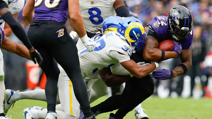Oct 12, 2025; Baltimore, Maryland, USA; Los Angeles Rams safety Quentin Lake (37) tackles Baltimore Ravens running back Derrick Henry (22) during the second quarter of the game at M&T Bank Stadium. Mandatory Credit: Peter Casey-Imagn Images Oct 12, 2025; Baltimore, Maryland, USA; Los Angeles Rams safety Quentin Lake (37) tackles Baltimore Ravens running back Derrick Henry (22) during the second quarter of the game at M&T Bank Stadium. Mandatory Credit: Peter Casey-Imagn Images