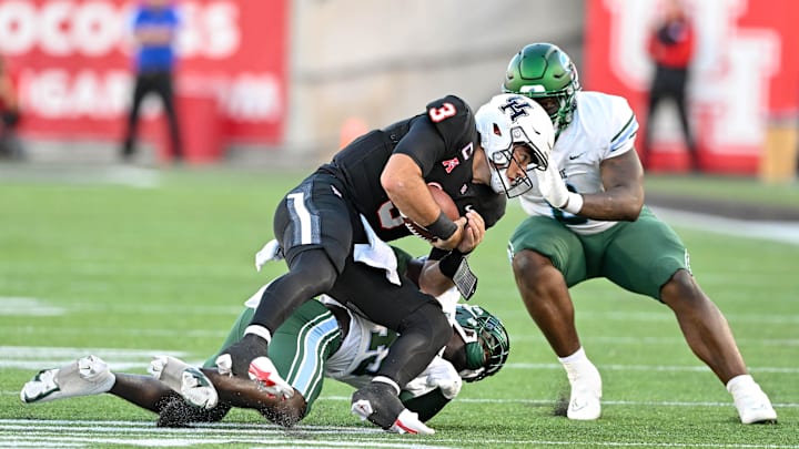 Sep 30, 2022; Houston, Texas, USA; Tulane Green Wave linebacker Corey Platt Jr. (45) and linebacker Darius Hodges (6) tackle Houston Cougars quarterback Clayton Tune (3) during the first half at TDECU Stadium in Houston, Texas. Mandatory Credit: Maria Lysaker-Imagn Images Sep 30, 2022; Houston, Texas, USA; Tulane Green Wave linebacker Corey Platt Jr. (45) and linebacker Darius Hodges (6) tackle Houston Cougars quarterback Clayton Tune (3) during the first half at TDECU Stadium in Houston, Texas. Mandatory Credit: Maria Lysaker-Imagn Images