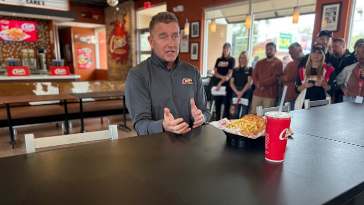 Kirk Herbstreit makes an appearance at a Raising Cane's location in Austin, Texas ahead of an 'ESPN College GameDay' taping on October 18, 2024