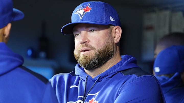 Apr 16, 2025; Toronto, Ontario, CAN; Toronto Blue Jays manager John Schneider talks with one of his assistant coaches before the start of the game against the Atlanta Braves at Rogers Centre