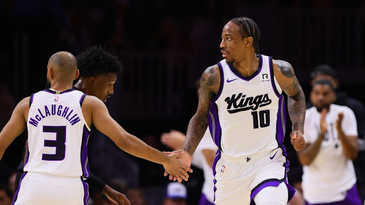 Nov 4, 2024; Miami, Florida, USA; Sacramento Kings forward DeMar DeRozan (10) celebrates with guard Jordan McLaughlin (3) after scoring against the Miami Heat during the second quarter at Kaseya Center. Mandatory Credit: Sam Navarro-Imagn Images