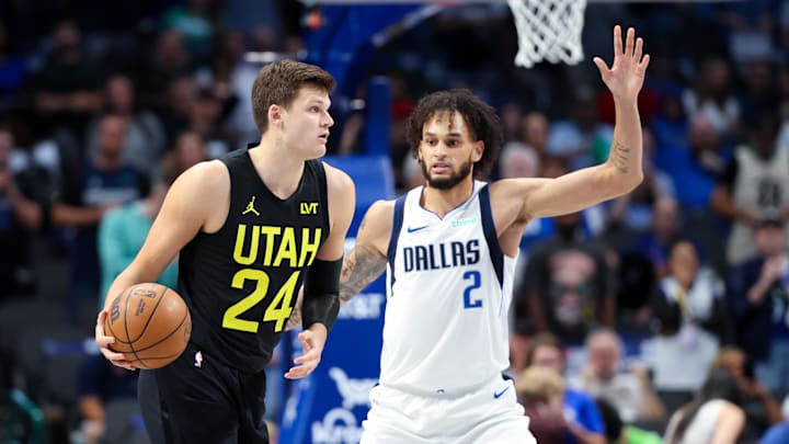 Oct 10, 2024; Dallas, Texas, USA;  Utah Jazz center Walker Kessler (24) dribbles as Dallas Mavericks center Dereck Lively II (2) defends during the first quarter at American Airlines Center. Mandatory Credit: Kevin Jairaj-Imagn Images